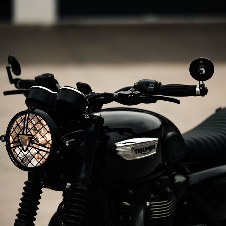 Closeup of Hindsight bar end mirrors on a Triumph Bonneville