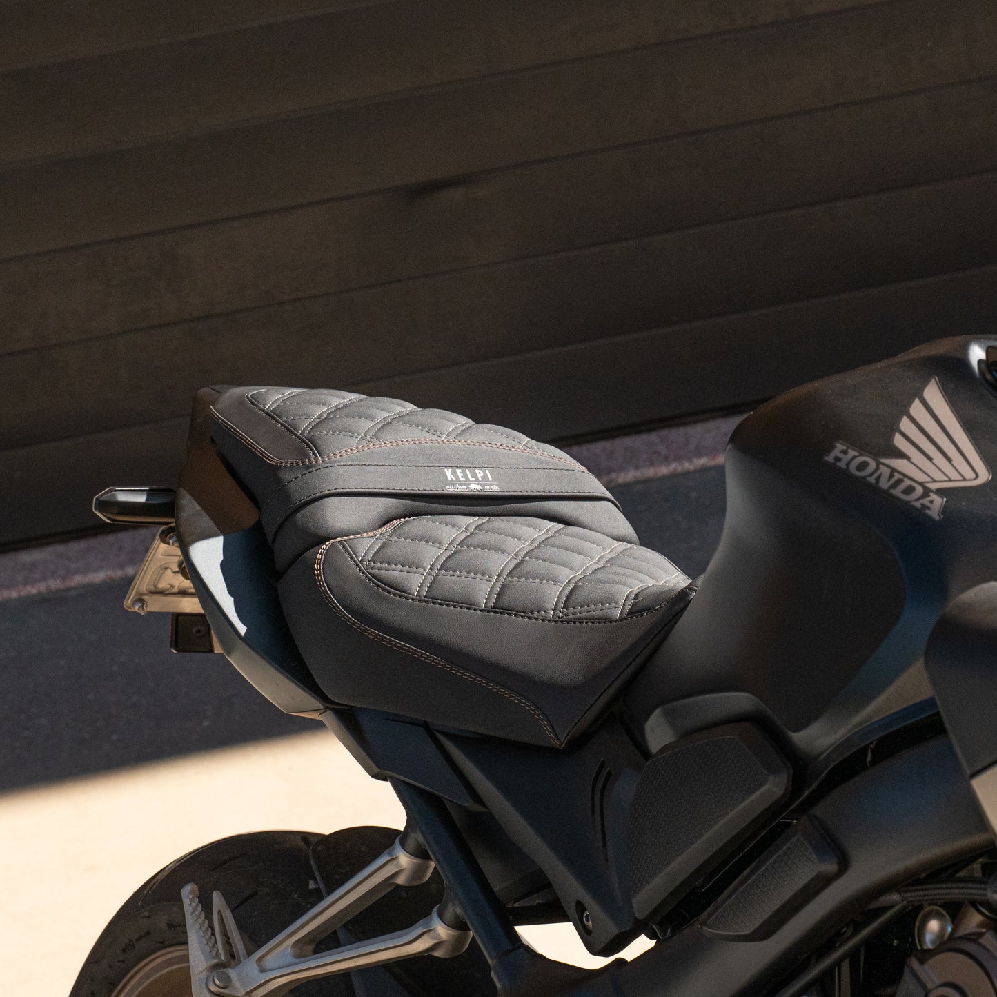 Honda CB650R with a Kelpi Custom Moto seat trim with a matching bronze detail stitch