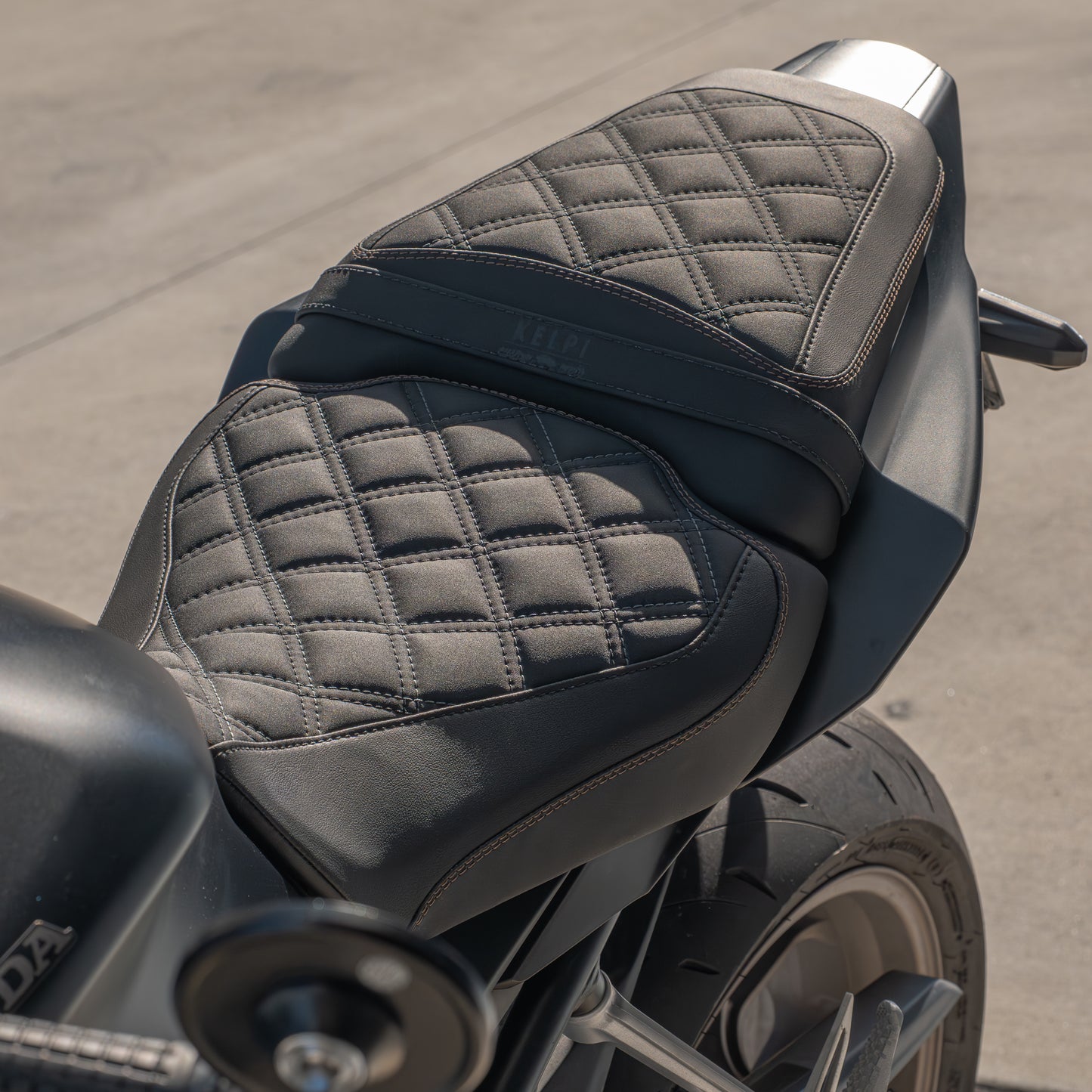 Honda CB650R with a Kelpi Custom Moto seat trim with a matching bronze detail stitch