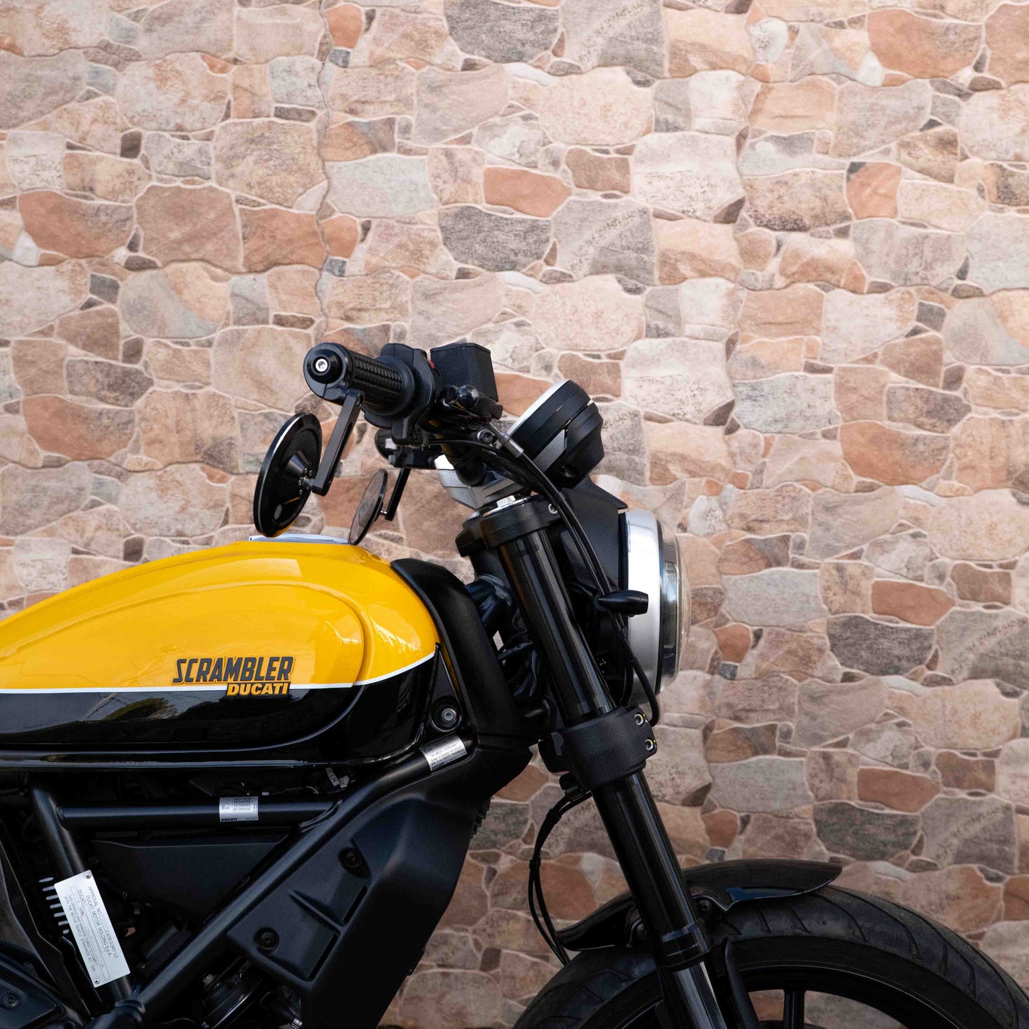 A Ducati Scrambler 800 with Kelpi Custom Moto Tracker 7050 Fatbars and Rounder mirrors