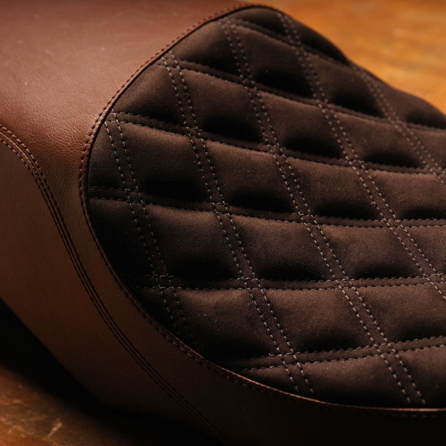 Close-up of a brown quilted leather seat