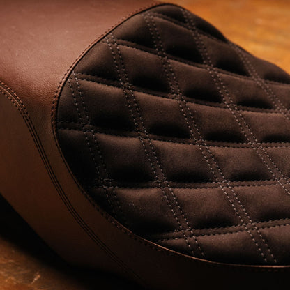 Close-up of a brown quilted leather seat