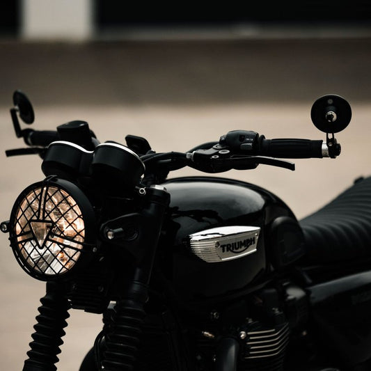 Closeup of Hindsight bar end mirrors on a Triumph Bonneville