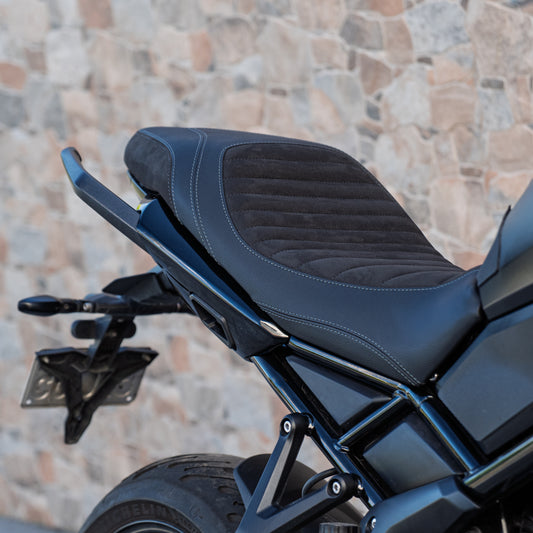A Triumph Tiger Sport 660 with a Kelpi Custom Moto comfort seat trim close up