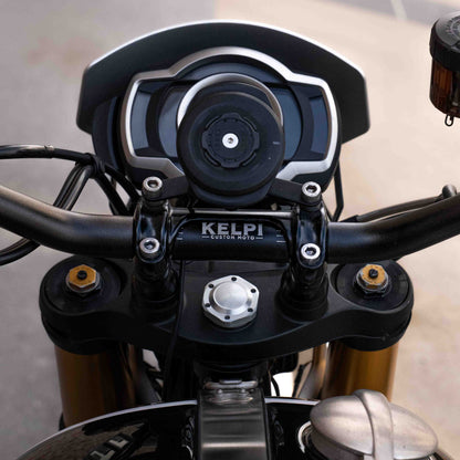 A triumph scrambler 1200 with a Kelpi Custom Moto Tracker 7050 Fat bars