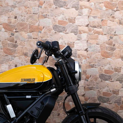 A Ducati Scrambler 800 with Kelpi Custom Moto Tracker 7050 Fatbars and Rounder mirrors